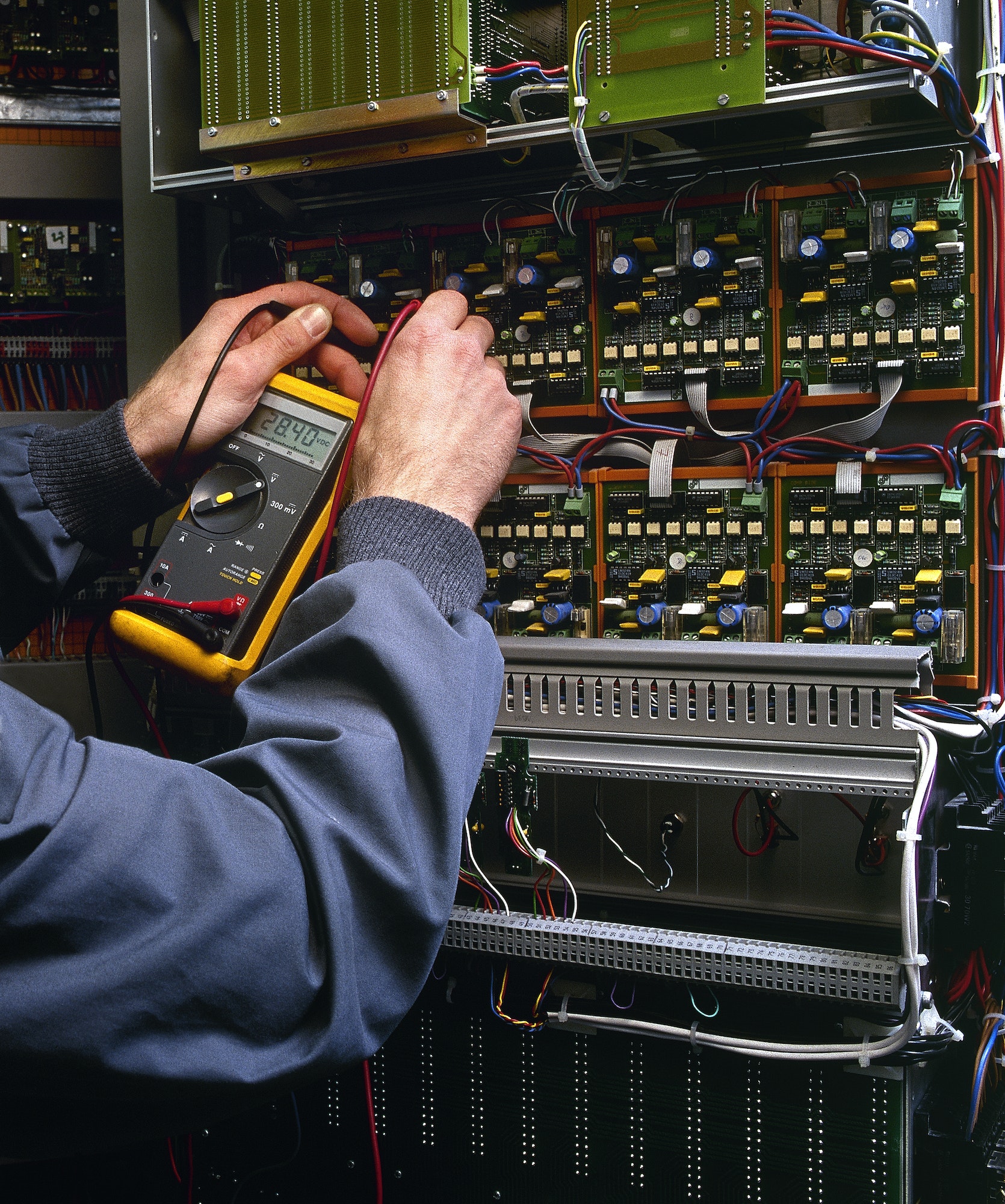 electrician testing industrial machine